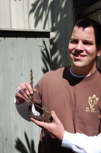 Chris Surber holds the iron hinge recently uncovered from around Drayton Hall's north flanker.  