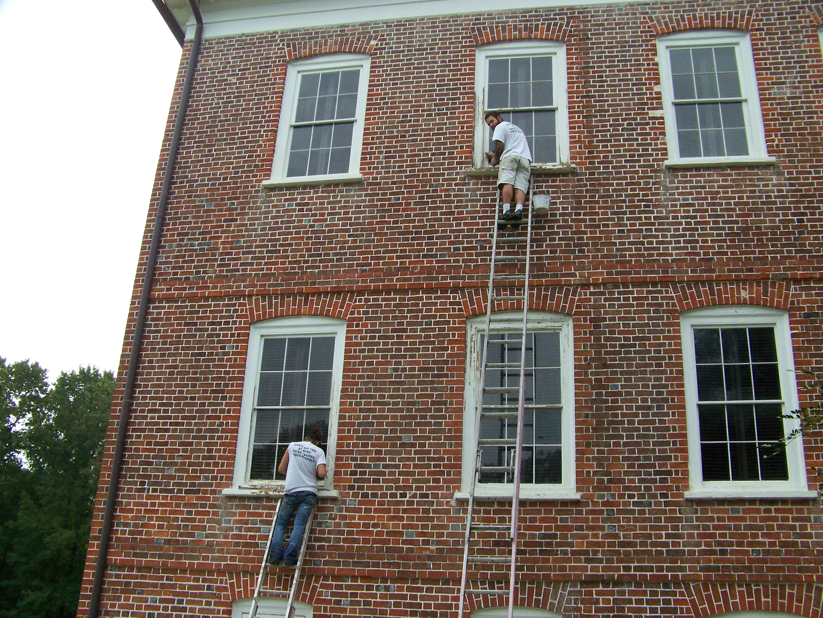 While work continues on the portico, preservation craftsmen will be repainting and repairing the historic windows.