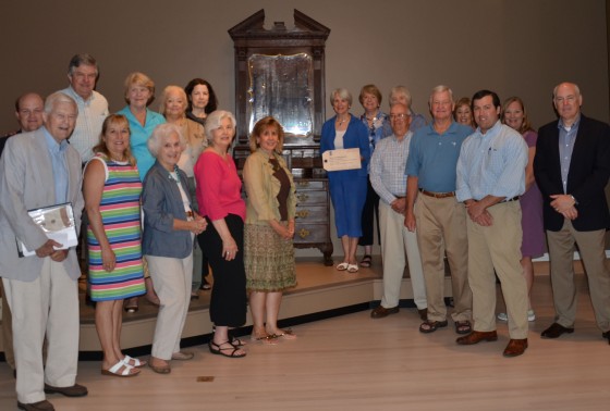 The Drayton Hall group at the preview; the author, in blue, stands next to the newly conserved Bureau Bookcase.